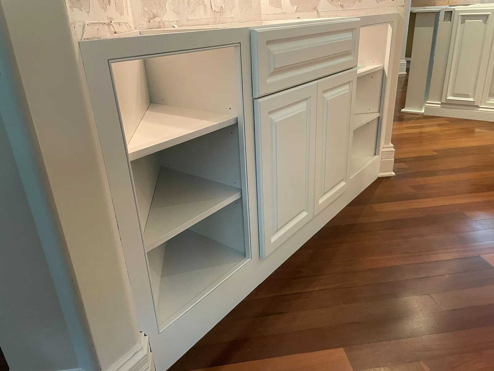 Built in cabinetry refinished in white