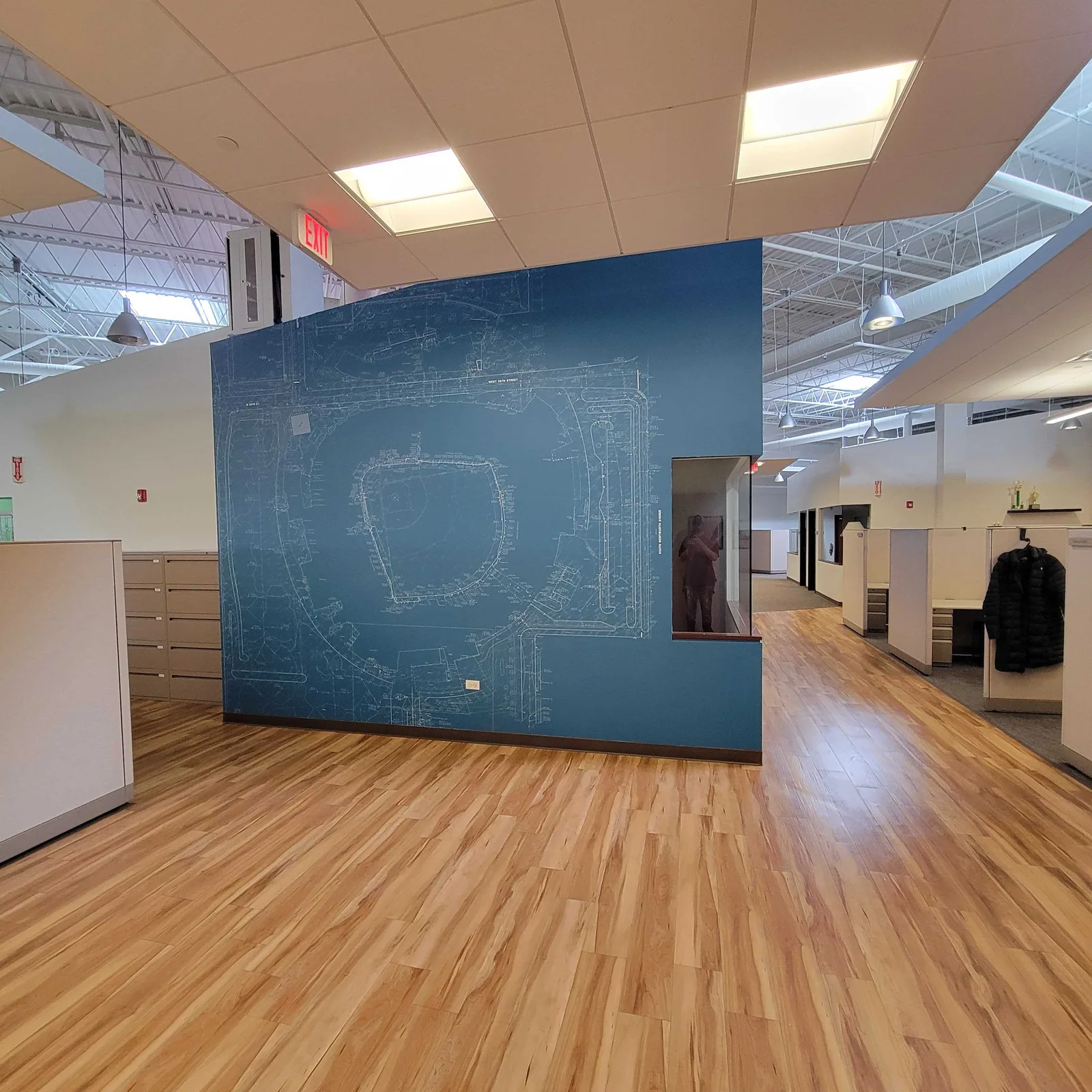 Wide view of a blueprint mural in an open office