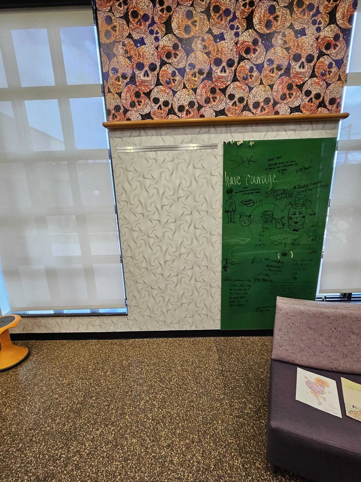 Patterned border wallcovering above a meeting room window