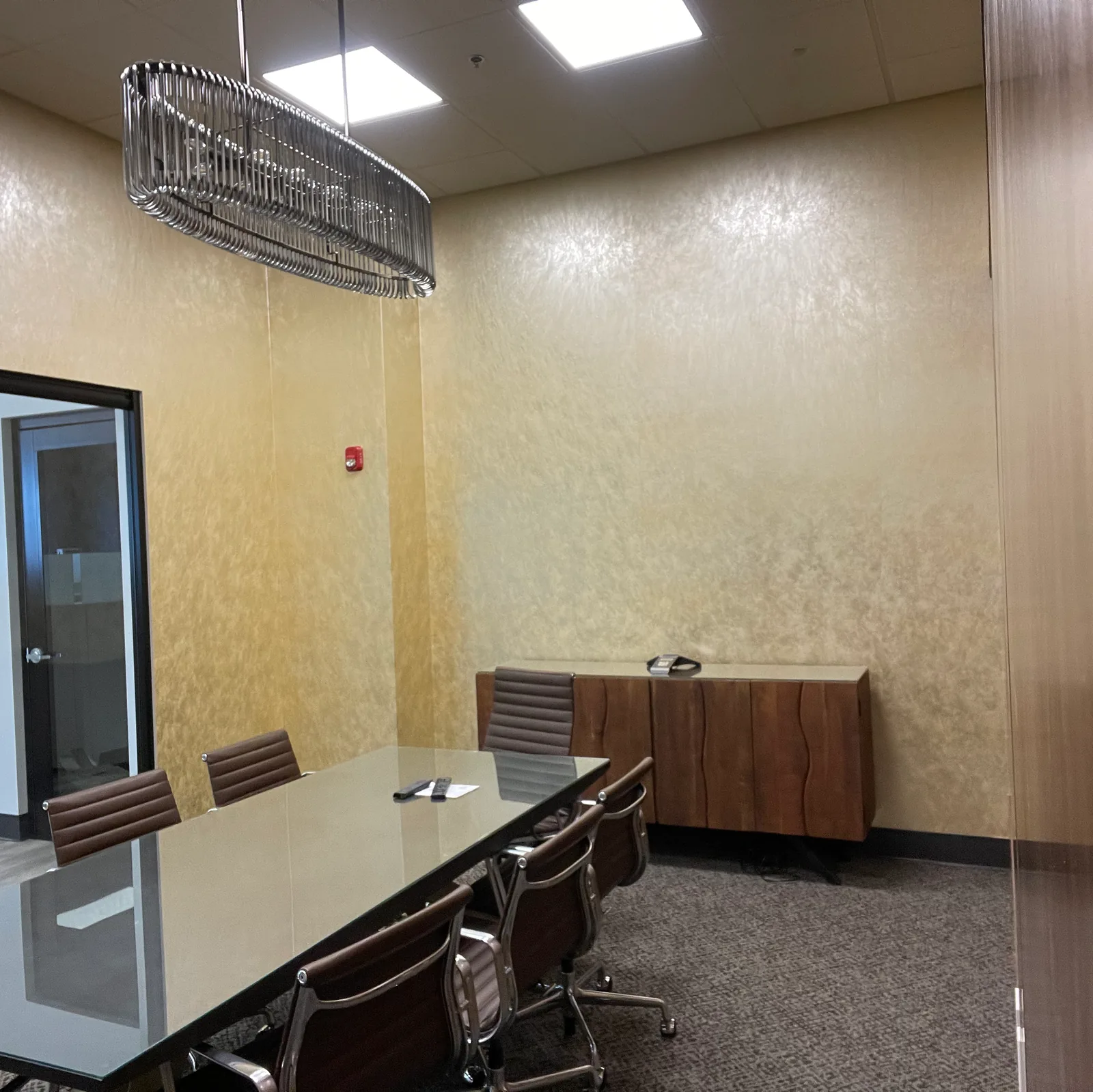 Textured gold wallcovering in a conference room