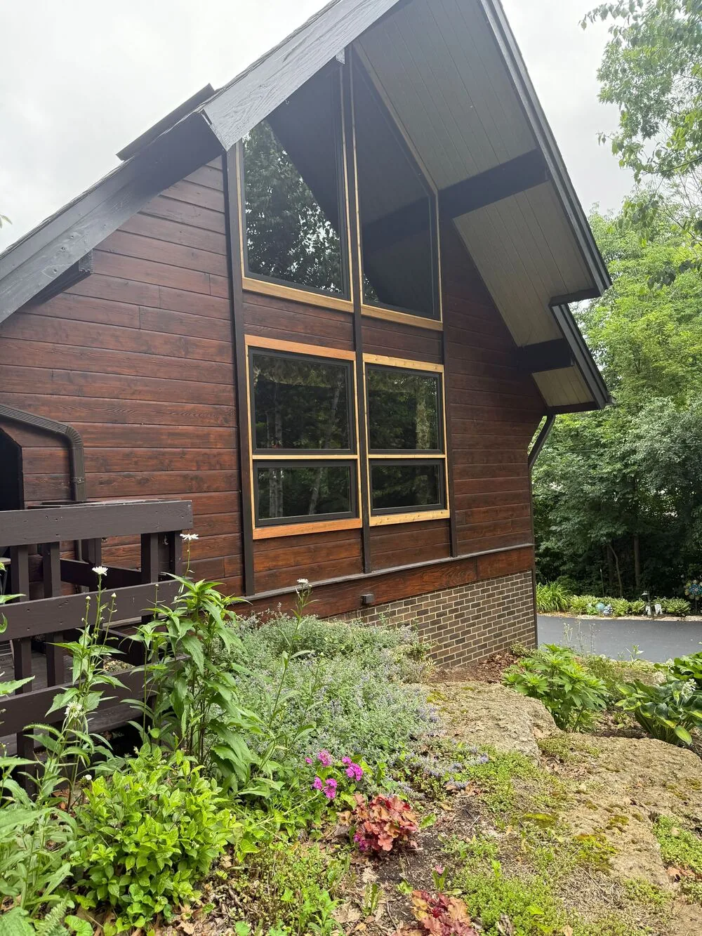 Cedar sided A frame home restained in a warm brown