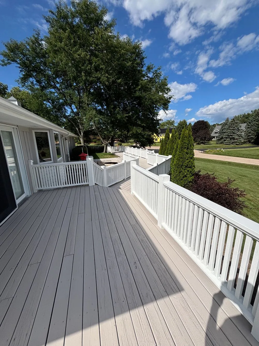 Refinished gray deck with white railings