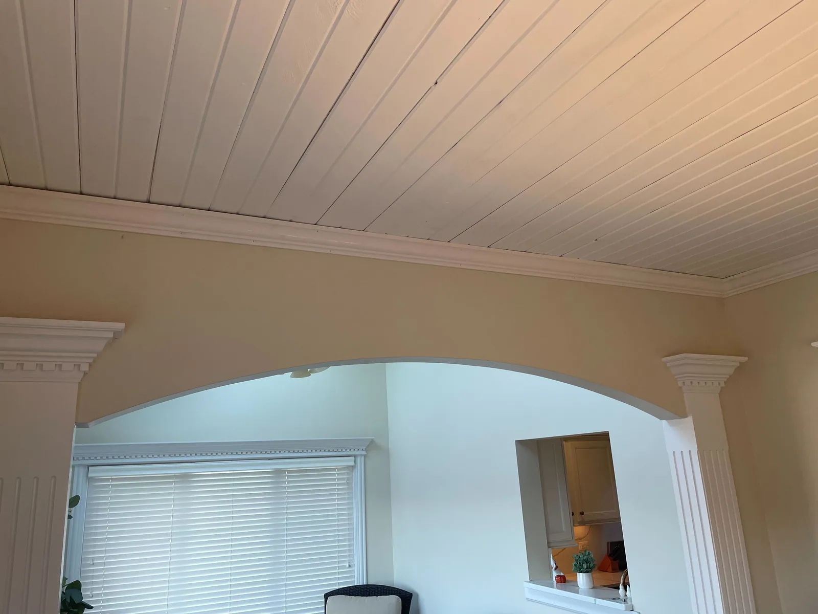 Arched entry and column repainted in a warm neutral