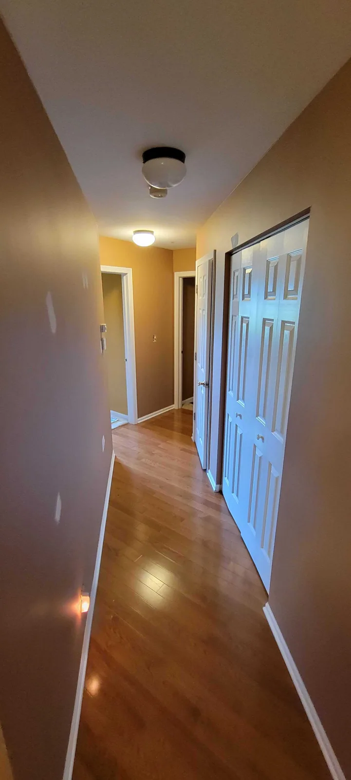 Hallway with repainted walls and ceiling