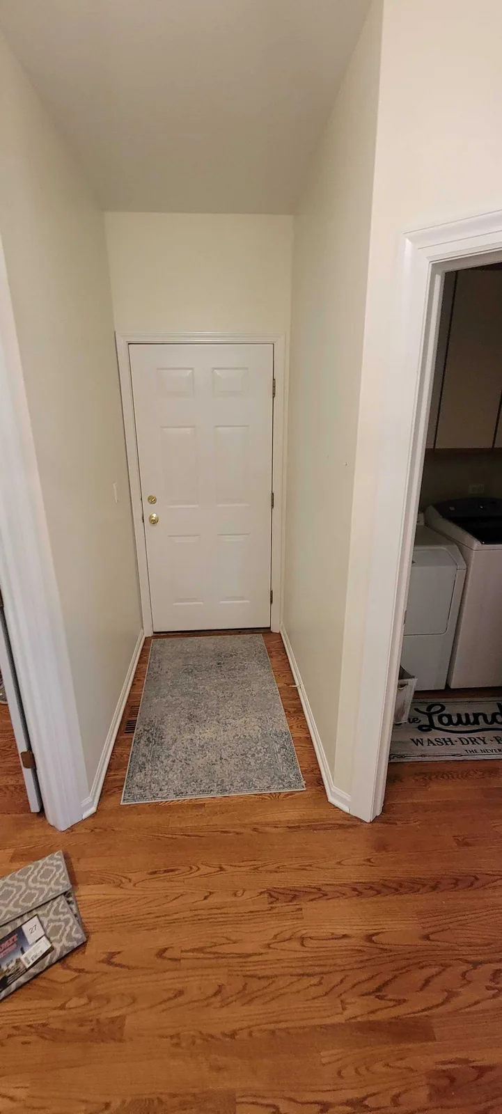 Front entry hall repainted in a soft cream