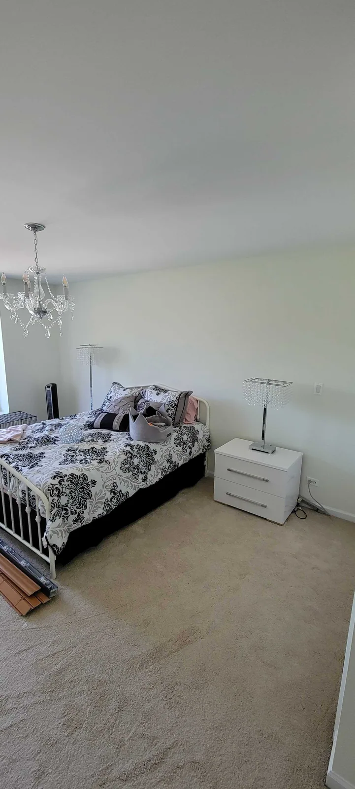 Finished bedroom repainted in a light gray