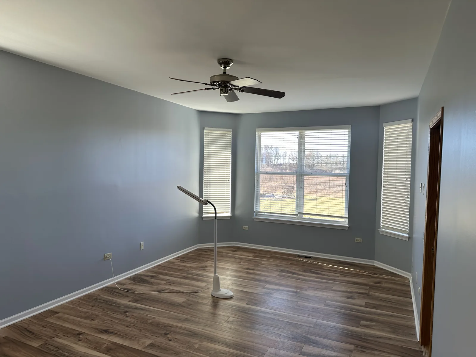 Bedroom repainted in a soft blue gray