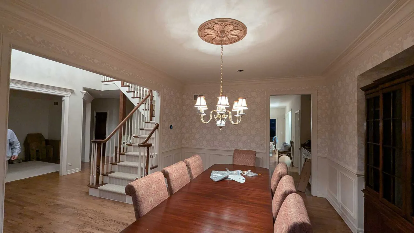 Dining room and staircase repainted in a soft neutral