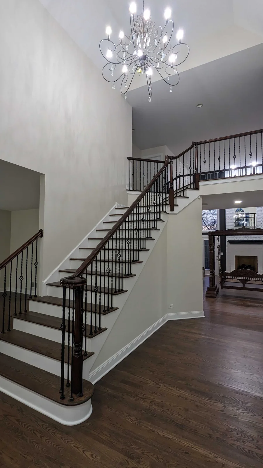 Foyer staircase with freshly painted walls and risers