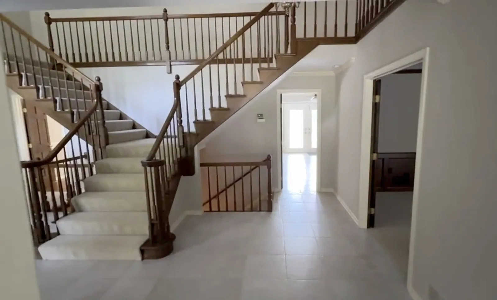 Foyer and staircase repainted in white