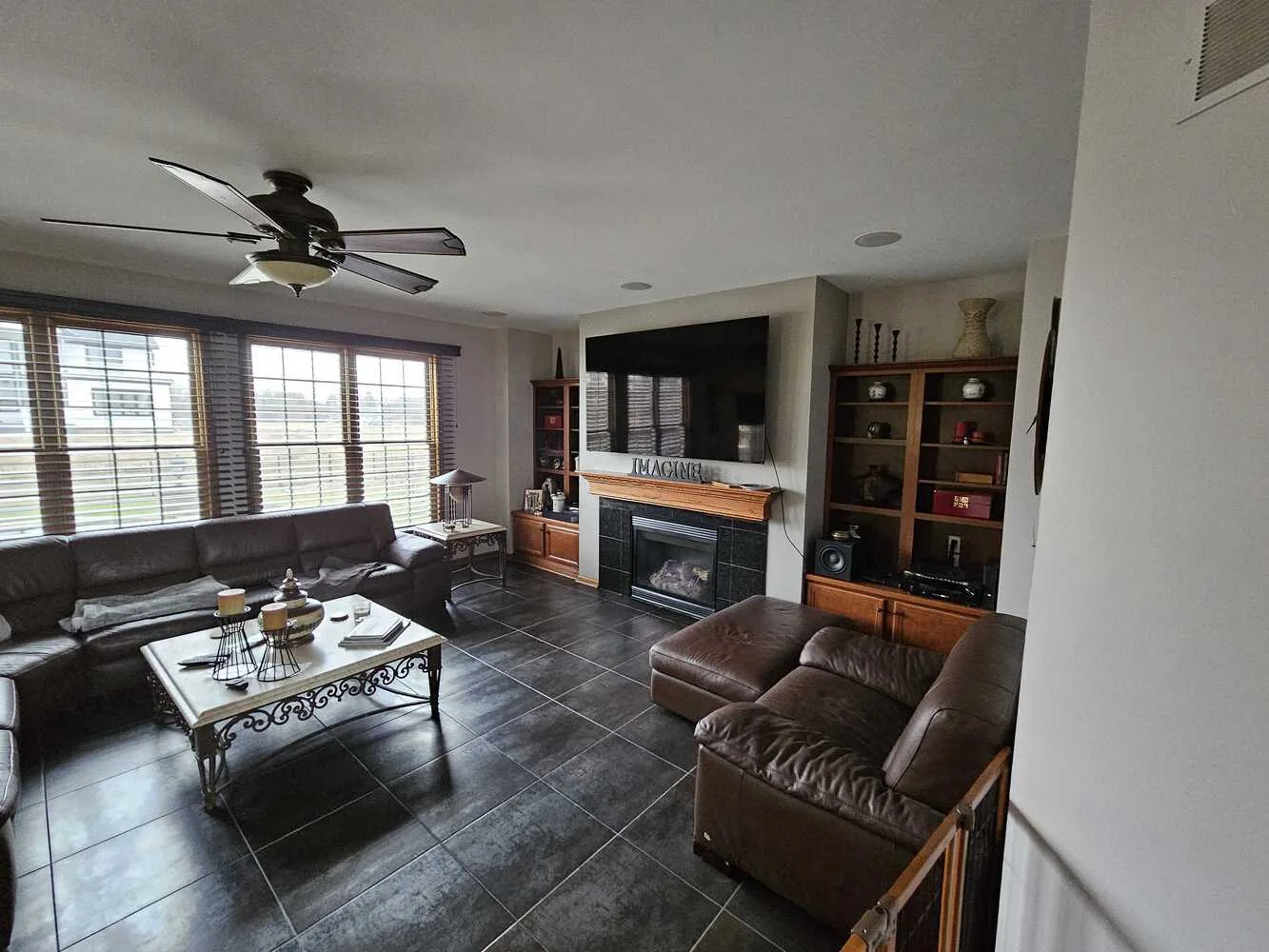 Family room with a repainted fireplace wall