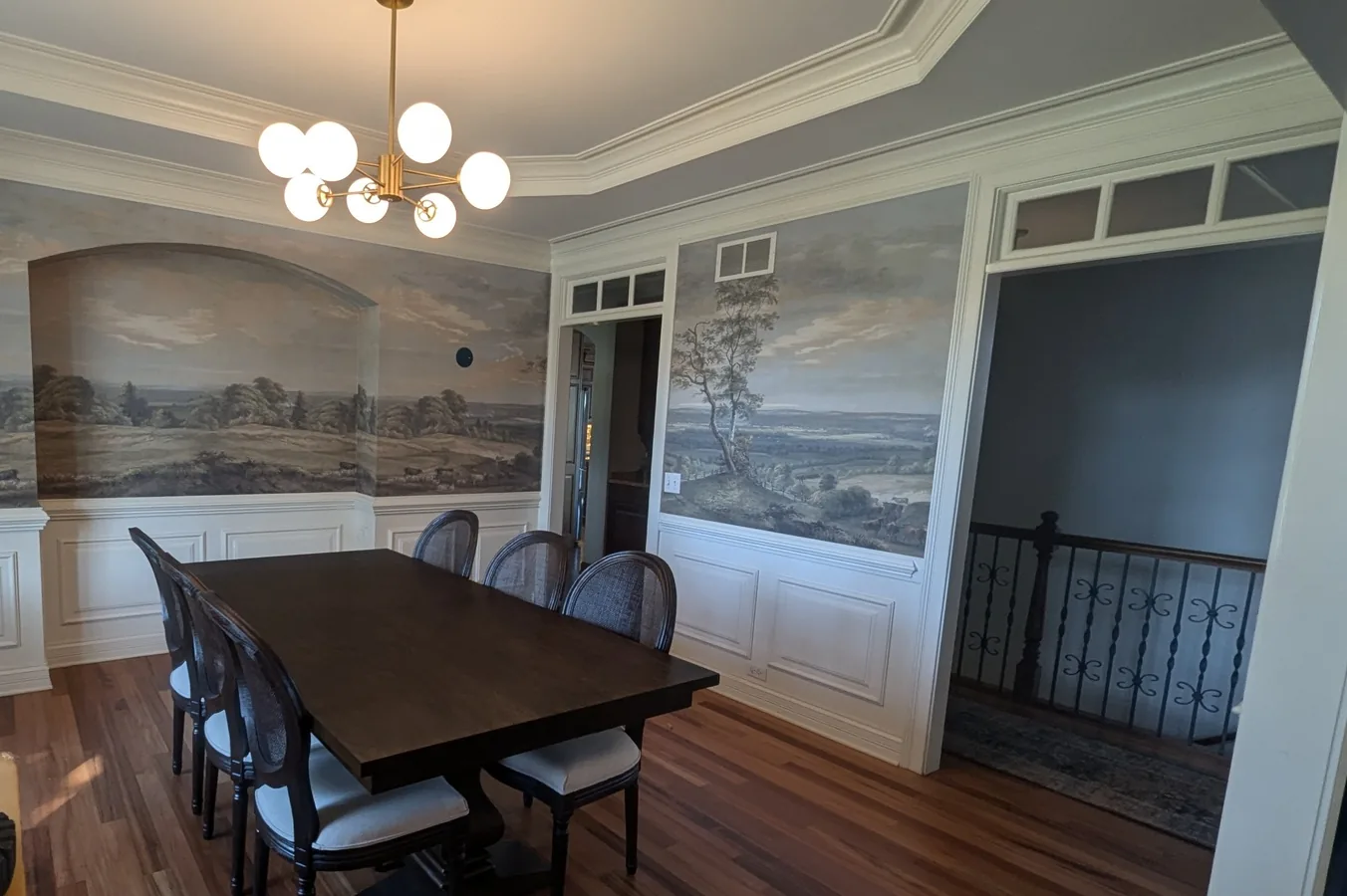 Scenic mural wallpaper in a dining room