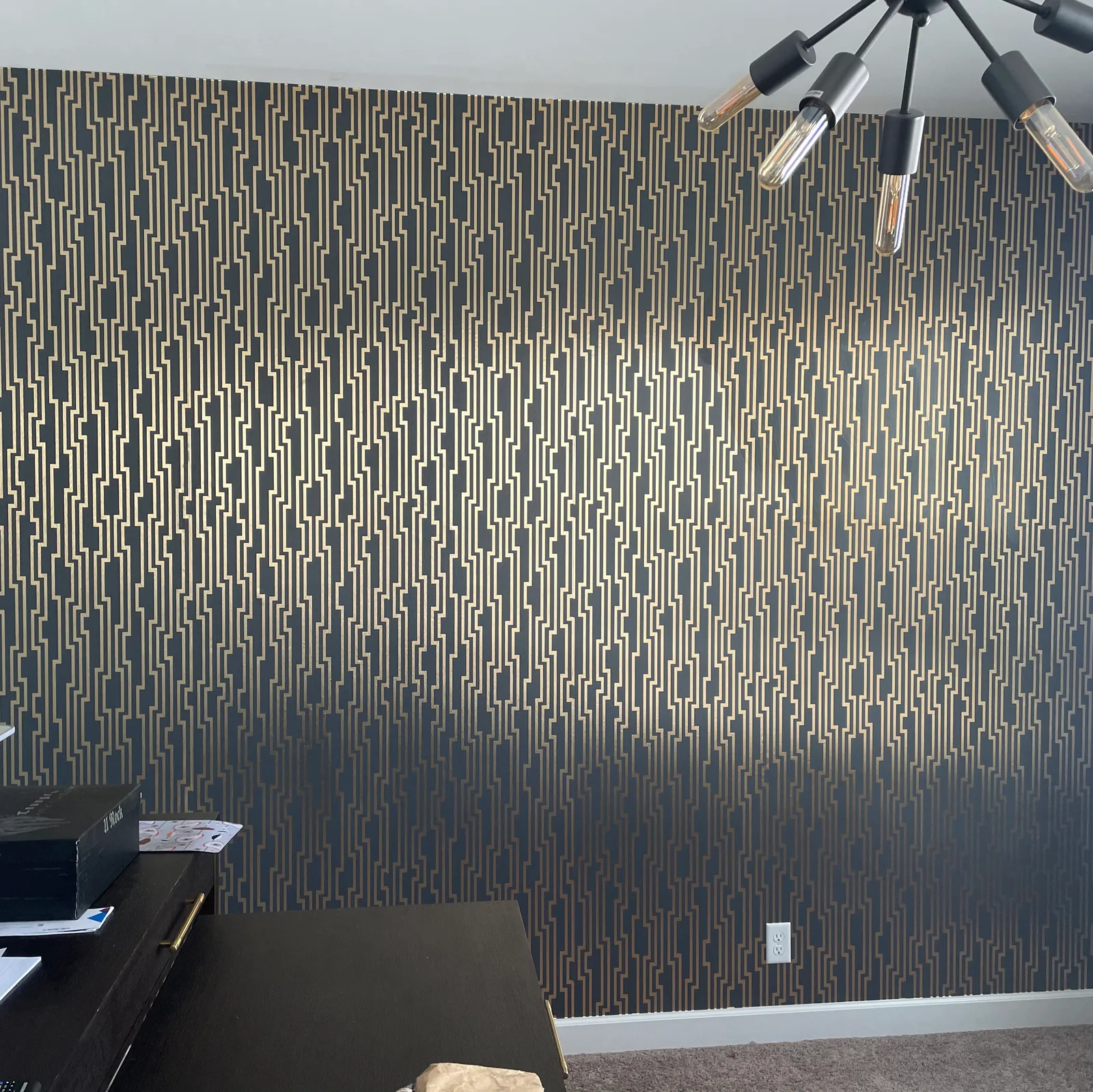 Metallic geometric wallpaper in a home office